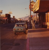 A car is parked in front of a waffle shop on Main Street in Bishop in 1968.
