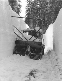 A black and white image of a snowblower stopped on State Route 120 W to Yosemite in 1983.